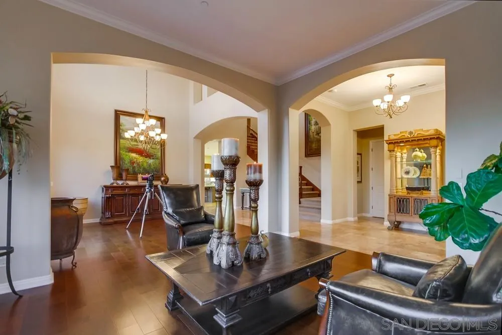 8248 Fortuna Santa Fe Road San Diego, CA 92127 - Photo 12 of 24 a living room with furniture and wooden floor