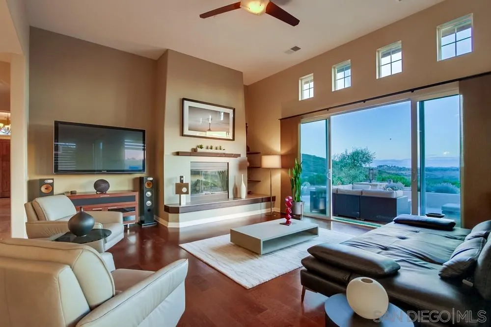 8248 Fortuna Santa Fe Road San Diego, CA 92127 - Photo 13 of 24 a living room with furniture and a flat screen tv