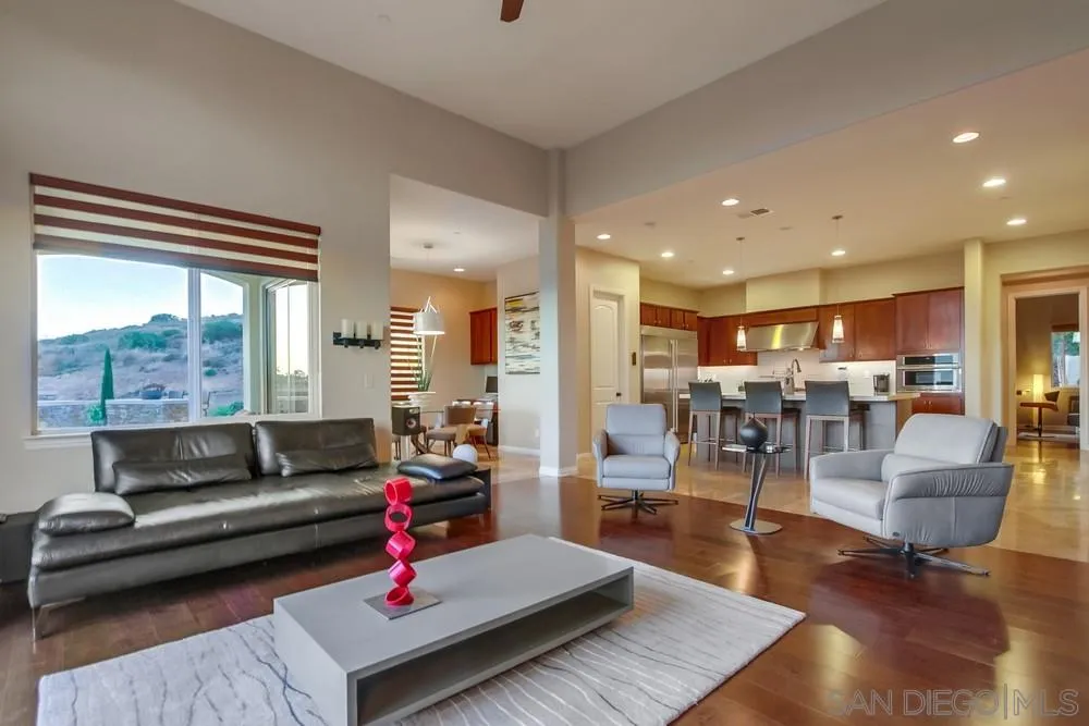 8248 Fortuna Santa Fe Road San Diego, CA 92127 - Photo 15 of 24 a living room with furniture and a large window