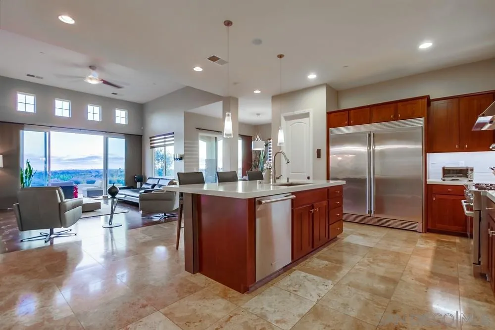 8248 Fortuna Santa Fe Road San Diego, CA 92127 - Photo 17 of 24 a large kitchen with stainless steel appliances lots of counter top space