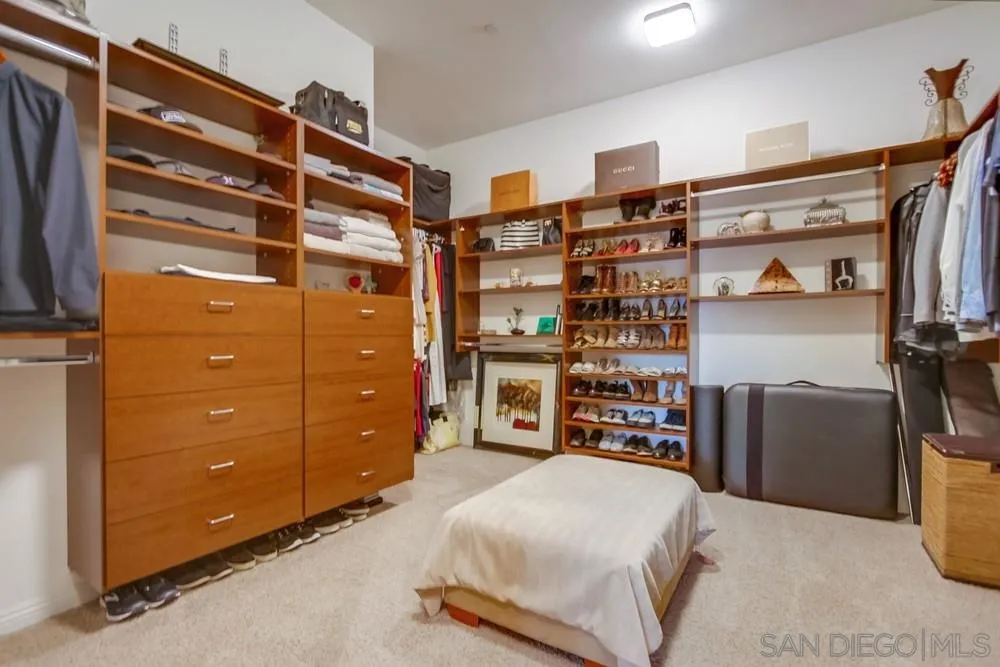 8248 Fortuna Santa Fe Road San Diego, CA 92127 - Photo 22 of 24 a bedroom with a bed and closet