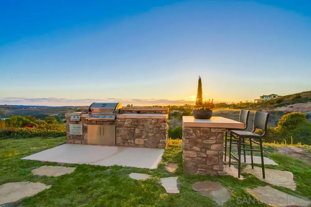8248 Fortuna Santa Fe Road San Diego, CA 92127 - Photo 6 of 24 a view of a terrace with a garden