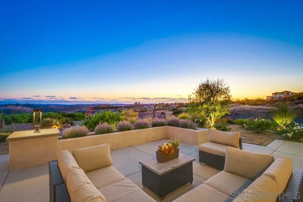 8248 Fortuna Santa Fe Road San Diego, CA 92127 - Photo 7 of 24 a view of a patio with couches and a flat screen tv