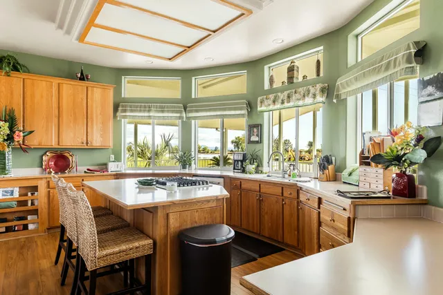 a very nice looking kitchen with a large window