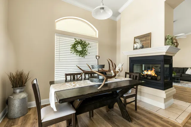 a living room with furniture a table and a fireplace