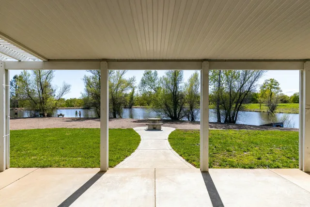 a view of swimming pool and outdoor seating
