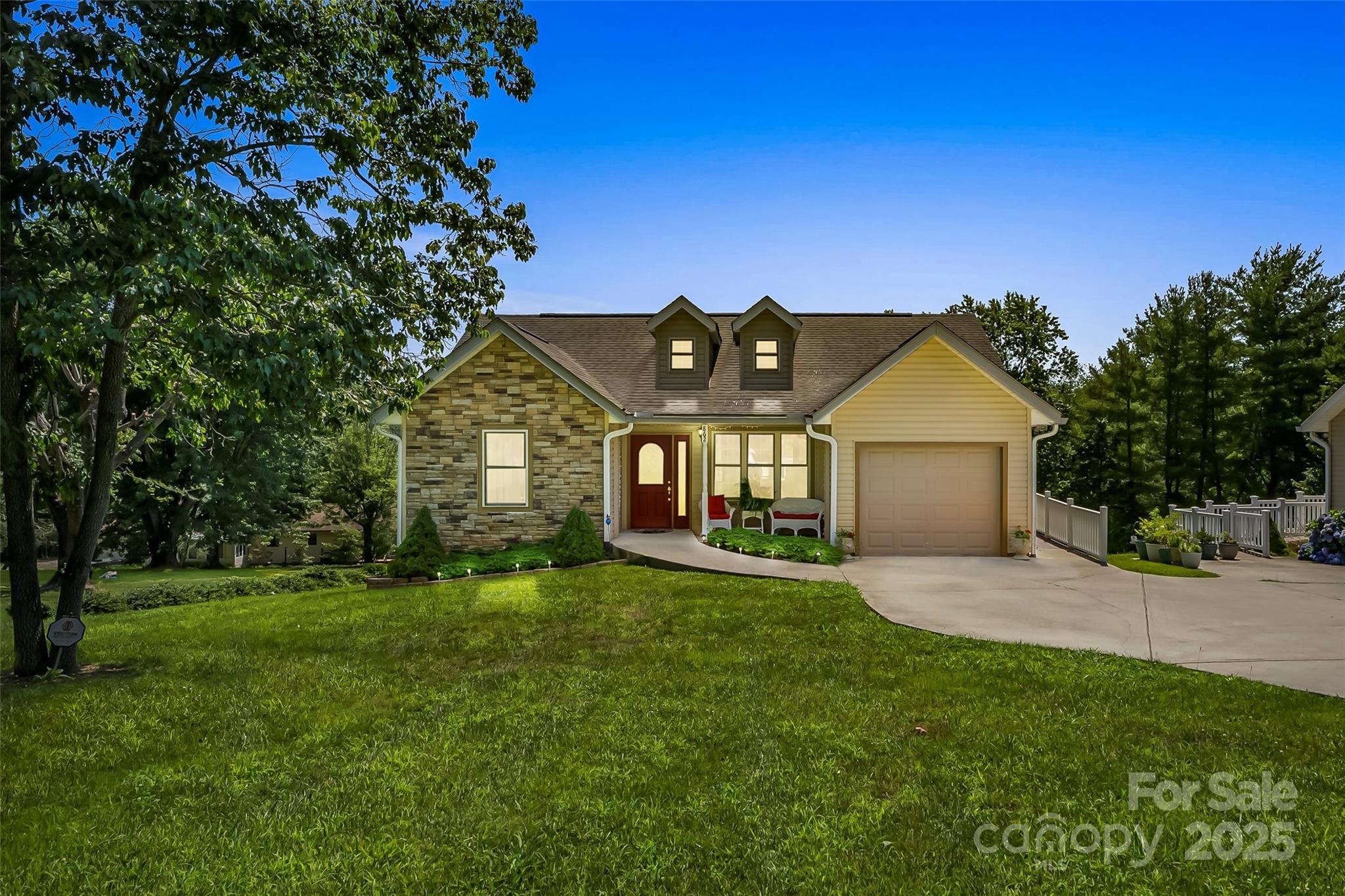 a front view of a house with a yard