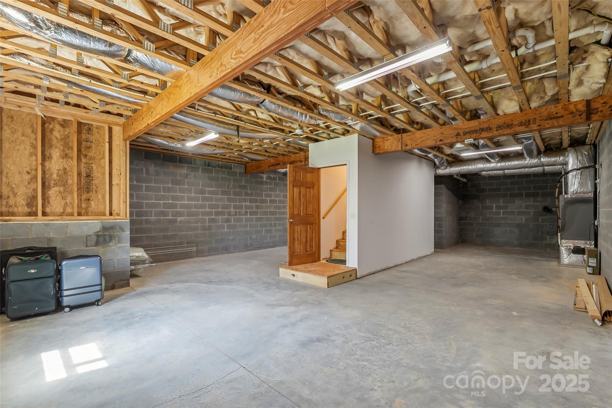 862 Asbury Road Candler, NC 28715 - Photo 13 of 18 a view of an empty room with a garage