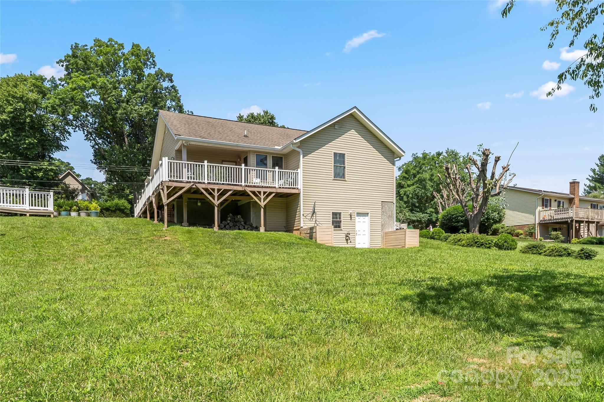 862 Asbury Road Candler, NC 28715 - Photo 16 of 18 a view of a house with backyard and garden
