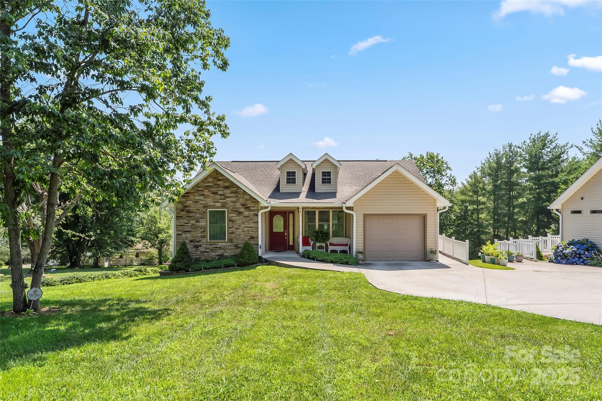 862 Asbury Road Candler, NC 28715 - Photo 18 of 18 a front view of house with yard and green space