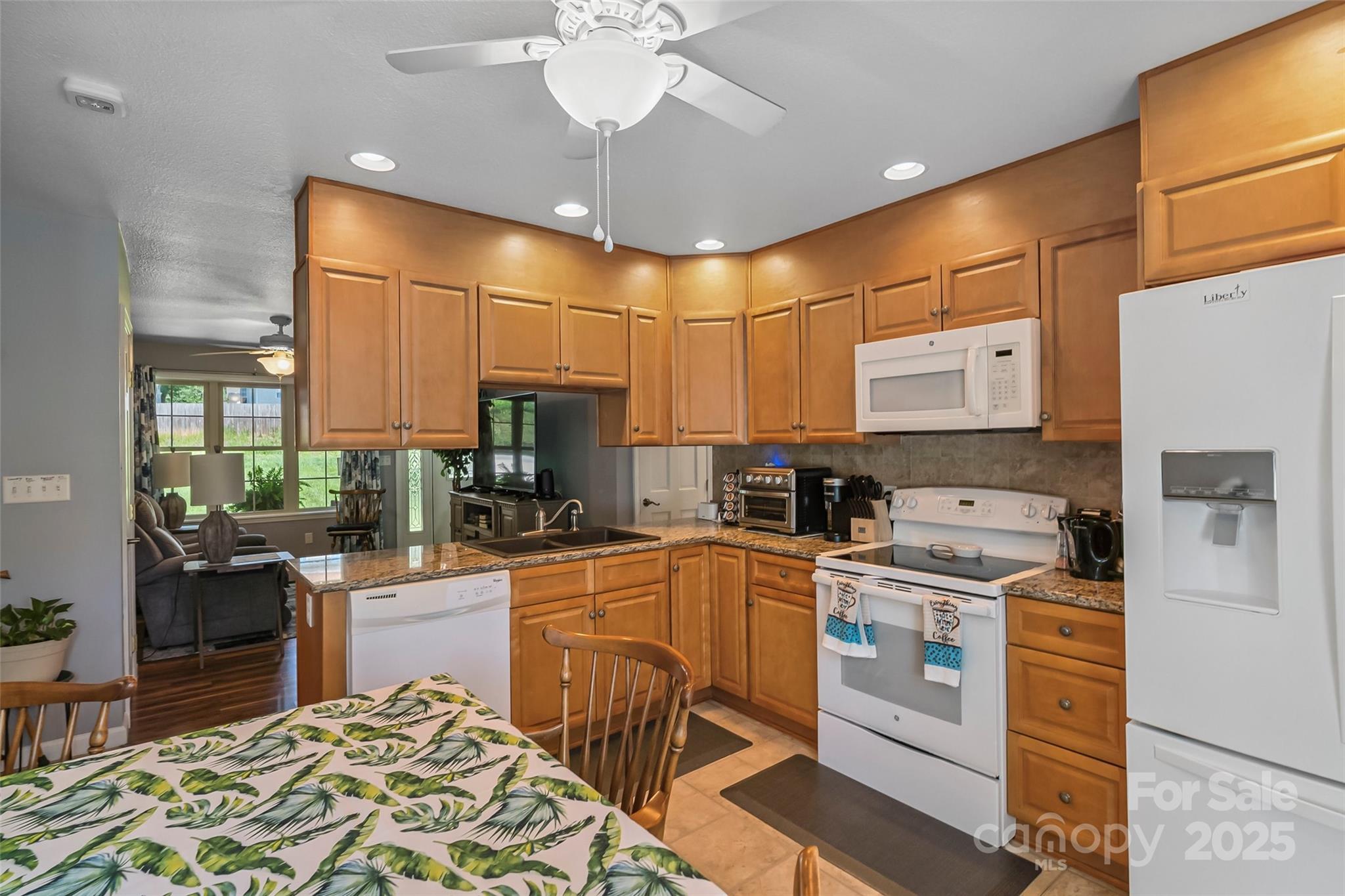 862 Asbury Road Candler, NC 28715 - Photo 5 of 18 a kitchen with a stove cabinets and counter space