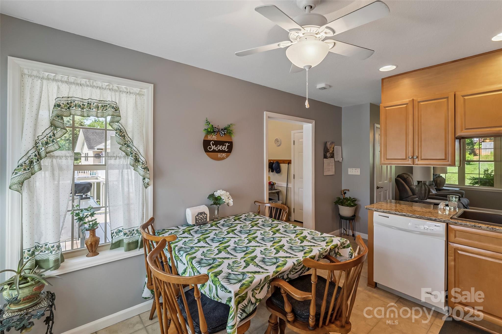 862 Asbury Road Candler, NC 28715 - Photo 6 of 18 a view of a dining room with furniture window and wooden floor