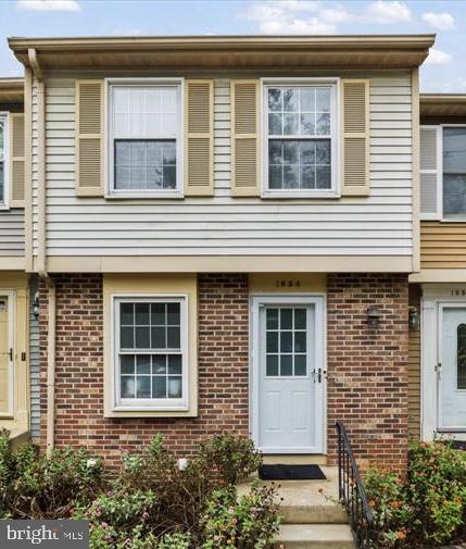 a front view of a house with windows