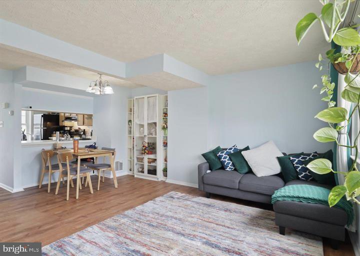 1654 Devil Lane Woodbridge, VA 22192 - Photo 2 of 21 a living room with furniture and wooden floor
