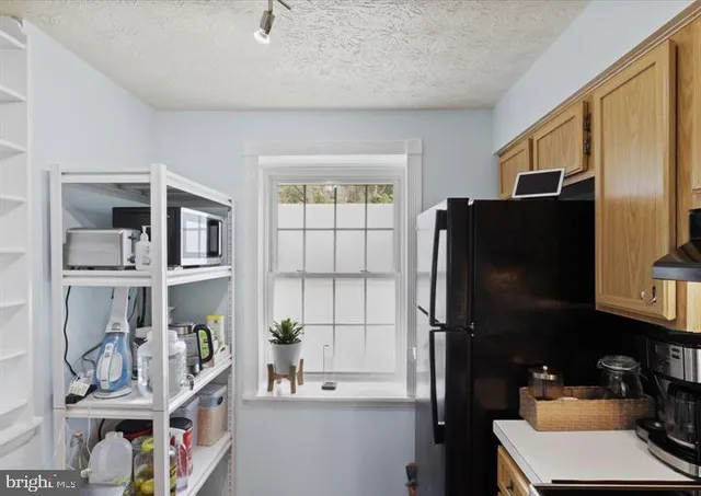 a view of living room and wooden floor