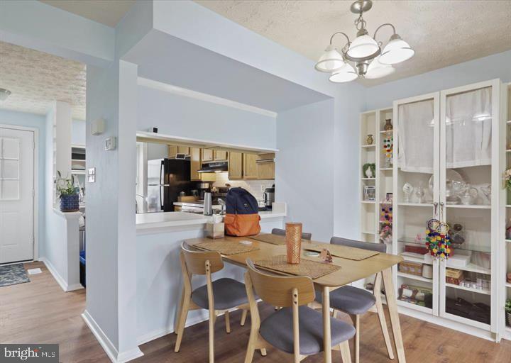 1654 Devil Lane Woodbridge, VA 22192 - Photo 7 of 21 a view of a dining room with furniture window and wooden floor