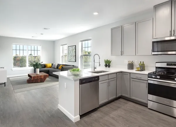 a kitchen with a sink cabinets and window