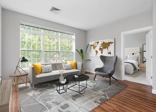 a living room with furniture and a table