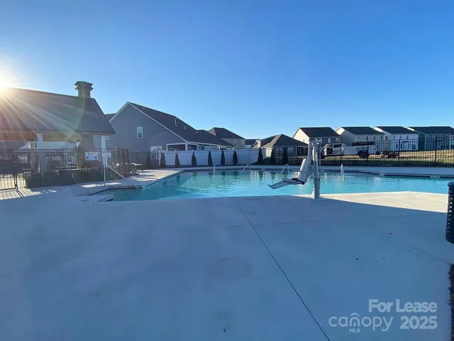 a view of a patio with dining table and chairs