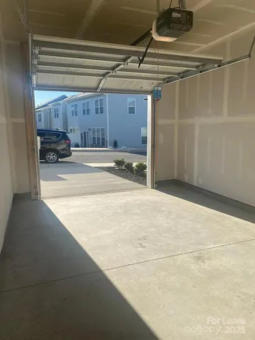 a view of a bathroom with a glass door and a shower