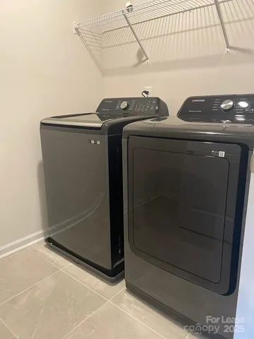 a bathroom with a granite countertop sink a mirror and a shower