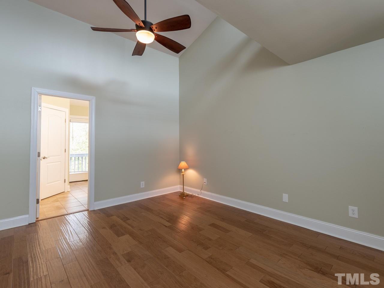 4407 Sunscape Lane Raleigh, NC 27613 - Photo 14 of 29 wooden floor in an empty room with a window