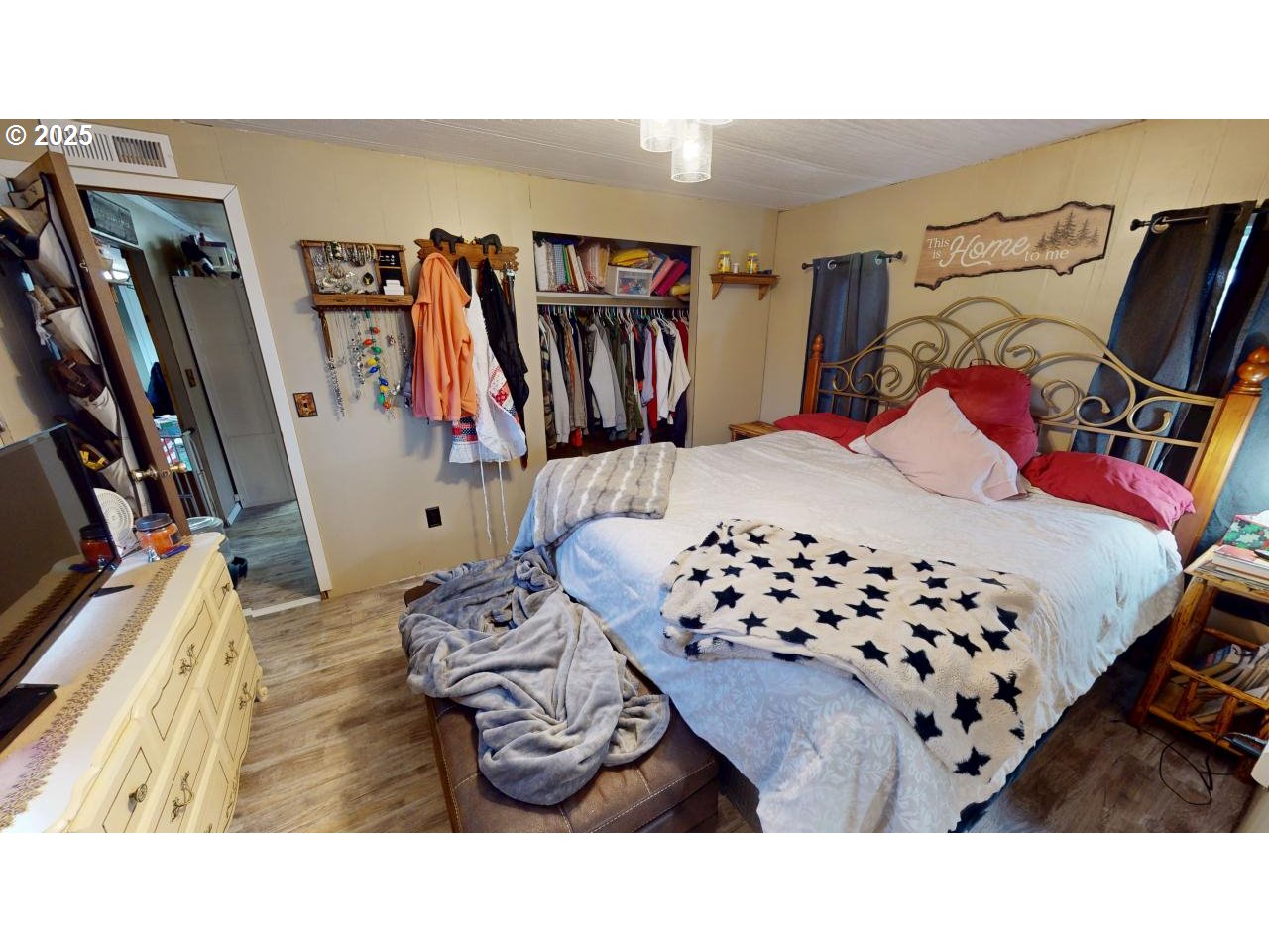 94608 Grange Road Gold Beach, OR 97444 - Photo 12 of 29 a bedroom with a bed and a walk in closet