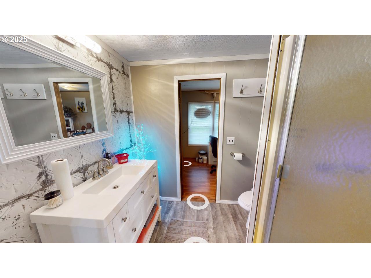 94608 Grange Road Gold Beach, OR 97444 - Photo 16 of 29 a bathroom with a sink vanity and mirror