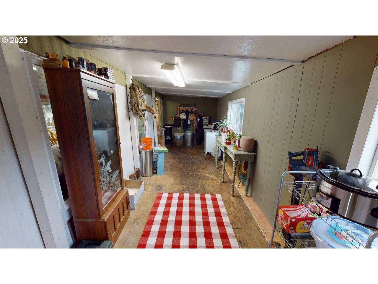 94608 Grange Road Gold Beach, OR 97444 - Photo 18 of 29 a view of a hallway with furniture and a rug