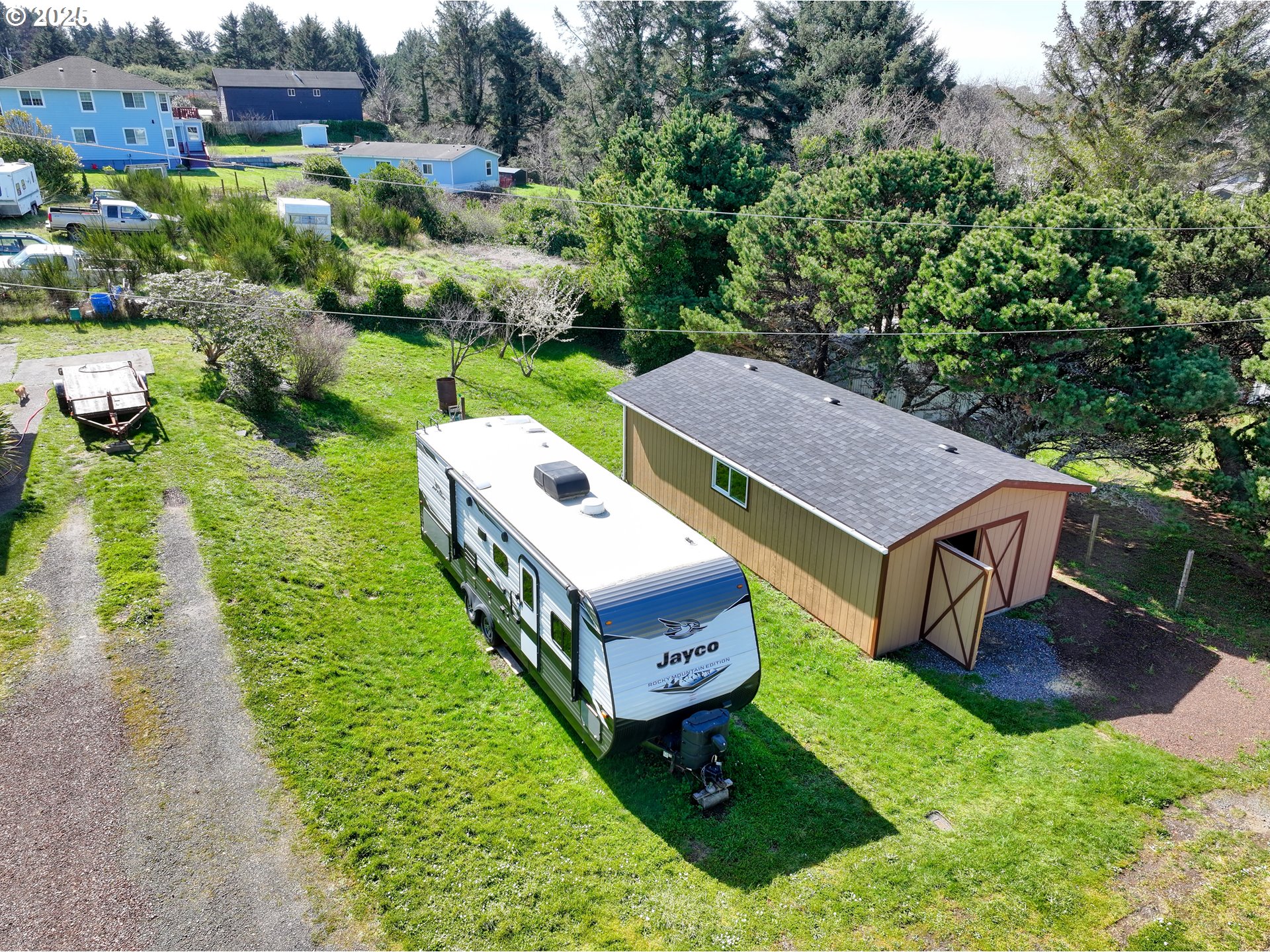 94608 Grange Road Gold Beach, OR 97444 - Photo 25 of 29 an aerial view of a house having yard table and chairs