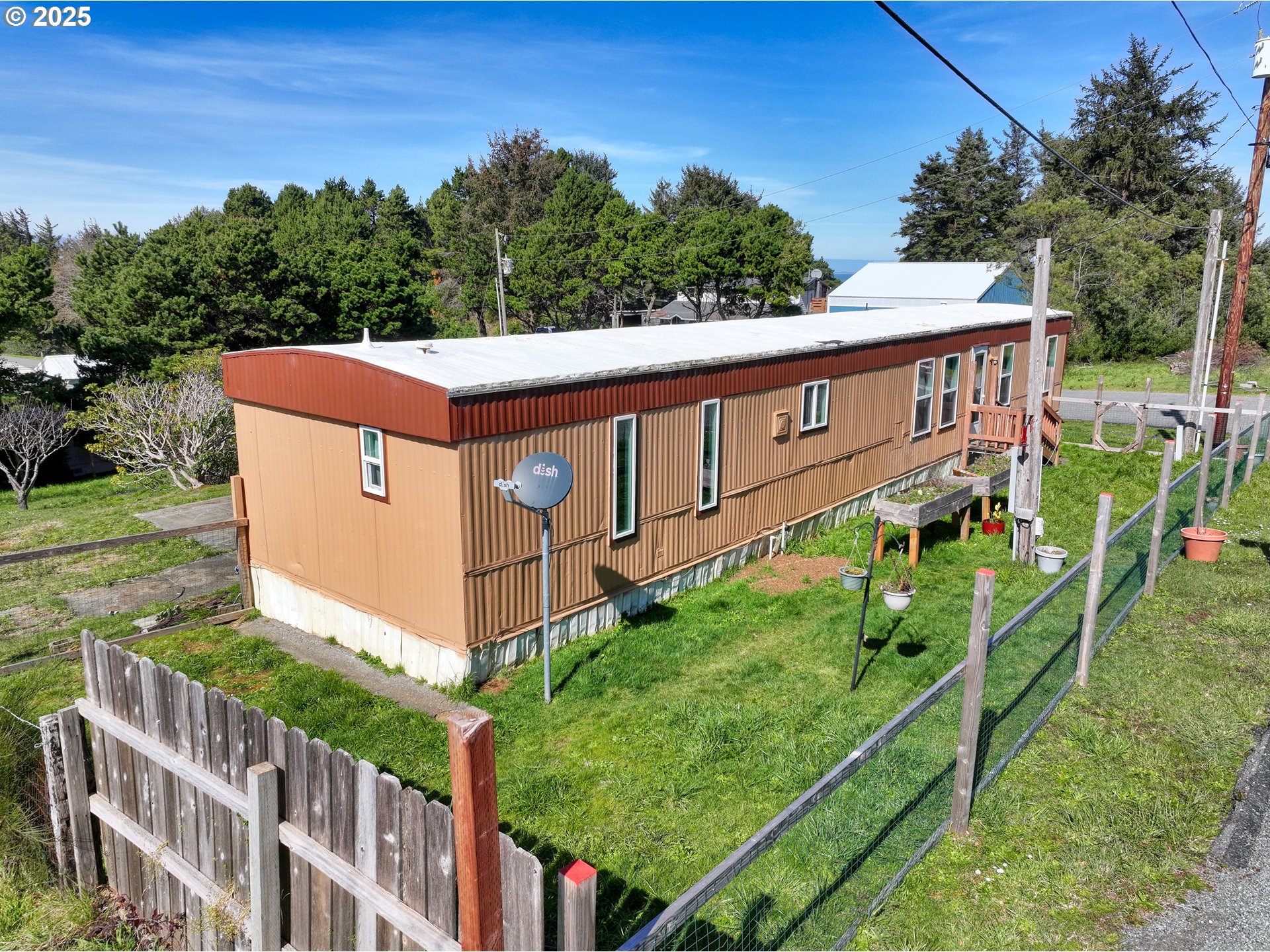 94608 Grange Road Gold Beach, OR 97444 - Photo 28 of 29 a view of a house with backyard and trees