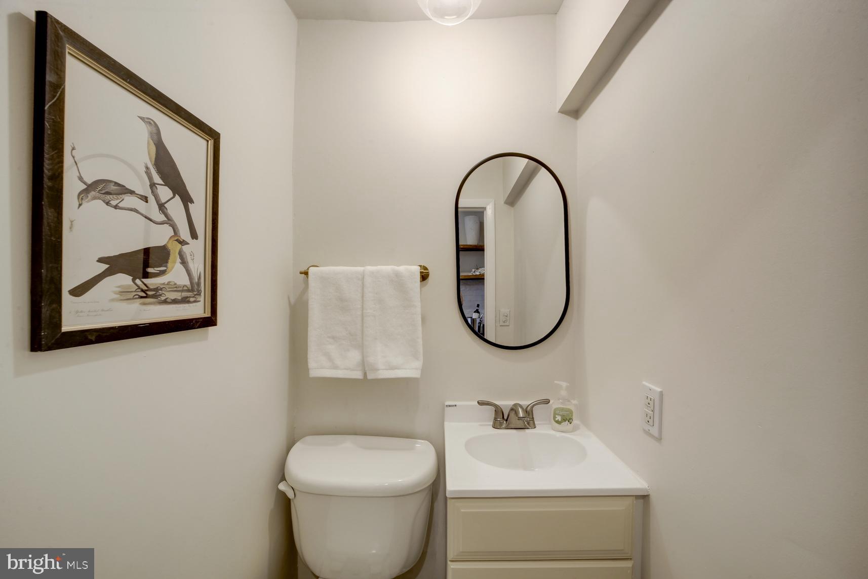 1823 4th Street Northwest Washington, DC 20001 - Photo 12 of 48 a bathroom with a toilet sink and mirror