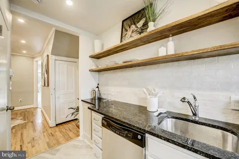 a kitchen with a sink and a refrigerator