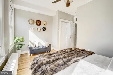 a bedroom with a bed and a couch