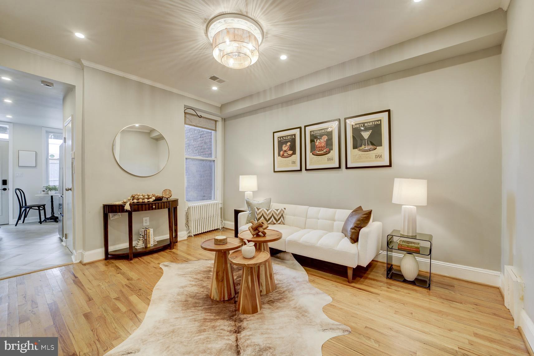 1823 4th Street Northwest Washington, DC 20001 - Photo 2 of 48 a living room with furniture a window and a clock
