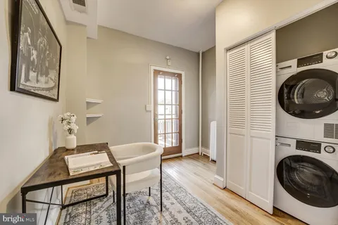 a view of a hallway with washer and dryer