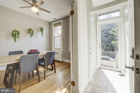 a view of a dining room with furniture window and wooden floor