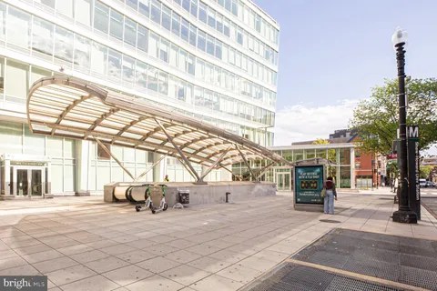 a view of a street with sitting area