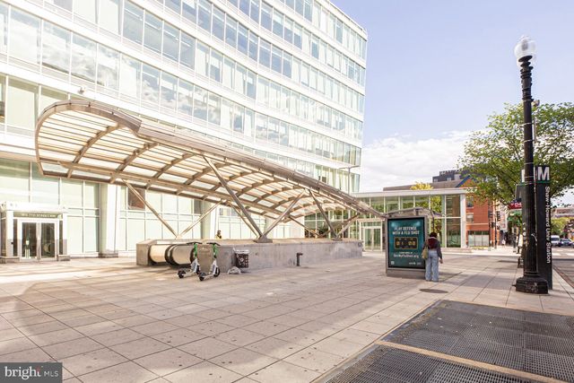 a view of a street with sitting area