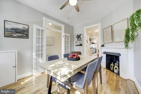 a view of a dining room with furniture window and wooden floor
