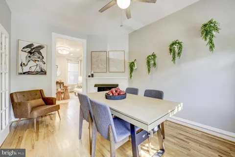 a view of a dining room with furniture and a chandelier
