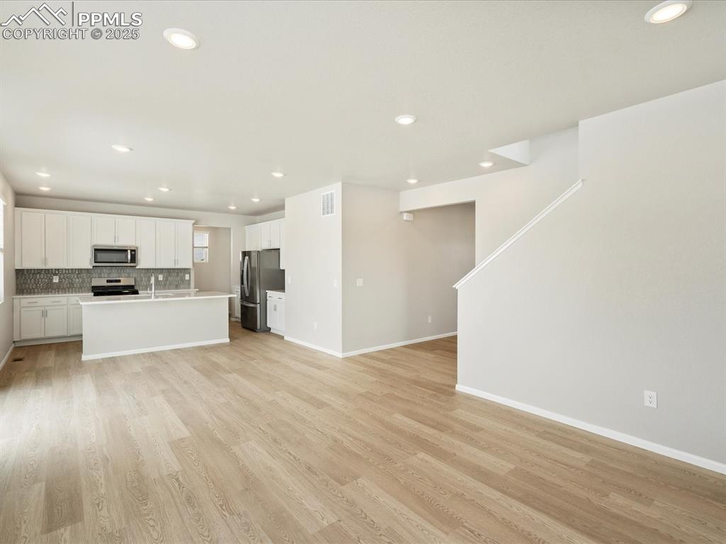 10648 Waterloo Drive Peyton, CO 80831 - Photo 13 of 36 a view of a kitchen with a sink and a refrigerator