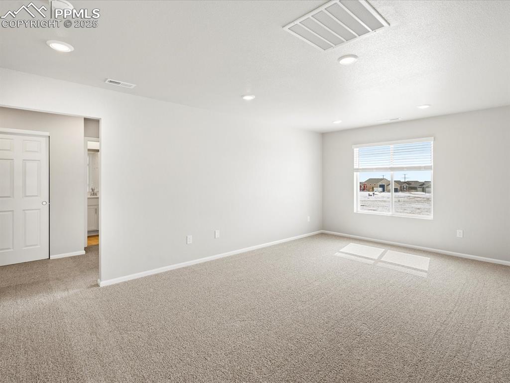 10648 Waterloo Drive Peyton, CO 80831 - Photo 15 of 36 an empty room with a empty space and windows