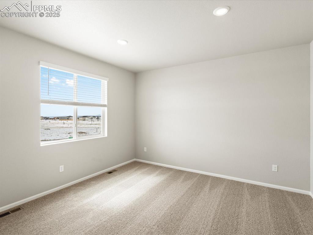 10648 Waterloo Drive Peyton, CO 80831 - Photo 16 of 36 an empty room with a window