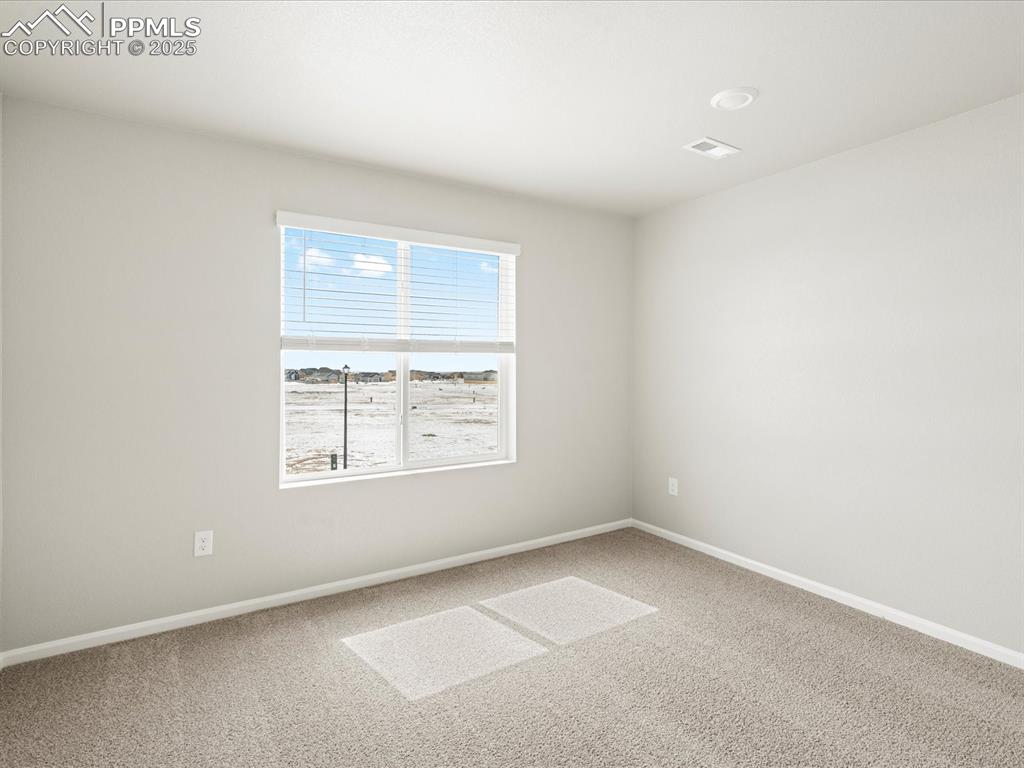 10648 Waterloo Drive Peyton, CO 80831 - Photo 19 of 36 an empty room with a window