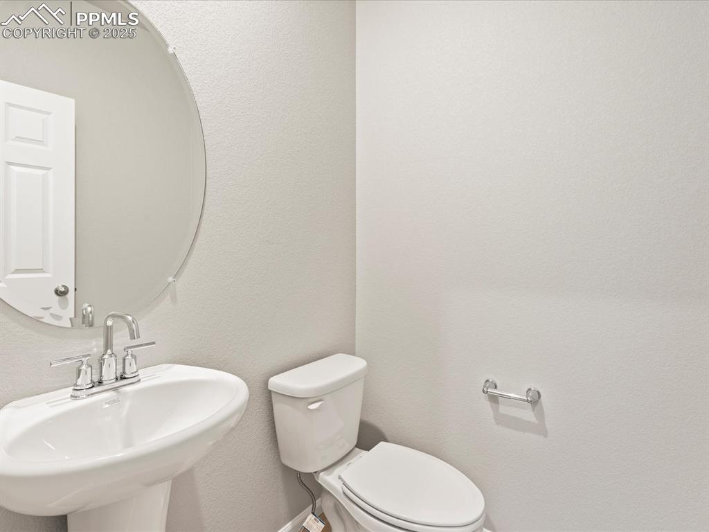 10648 Waterloo Drive Peyton, CO 80831 - Photo 24 of 36 a bathroom with a sink and a toilet