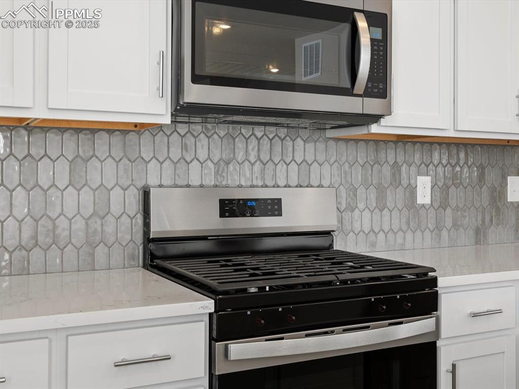 10648 Waterloo Drive Peyton, CO 80831 - Photo 5 of 36 a stove top oven sitting inside of a kitchen