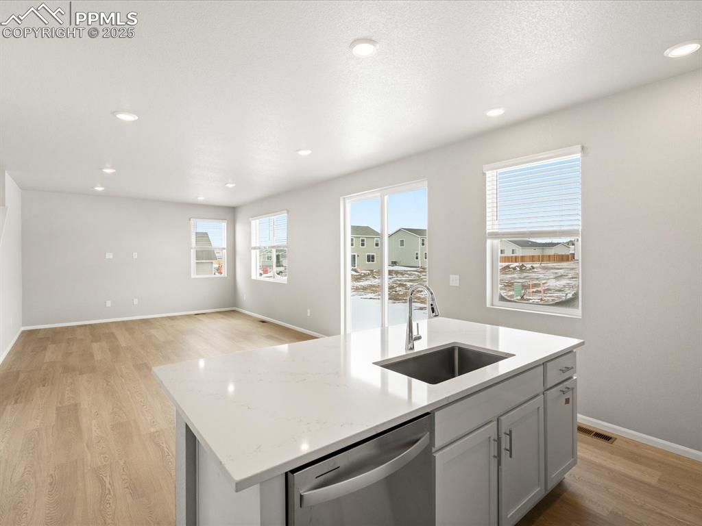 10648 Waterloo Drive Peyton, CO 80831 - Photo 10 of 36 a kitchen with a sink a stove and cabinets