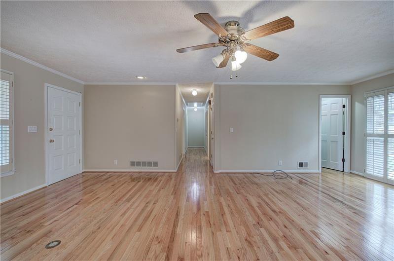 408 Mac Johnson Road Northwest Cartersville, GA 30121 - Photo 16 of 65 wooden floor in an empty room with a window