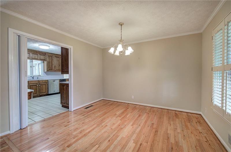 408 Mac Johnson Road Northwest Cartersville, GA 30121 - Photo 18 of 65 wooden floor in an empty room with a window
